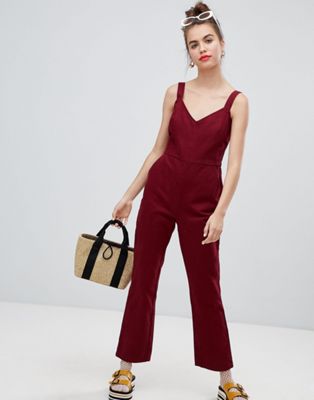 DESIGN denim jumpsuit with kickflare in berry