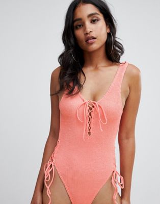 DESIGN lace up front crinkle swimsuit in pastel orange
