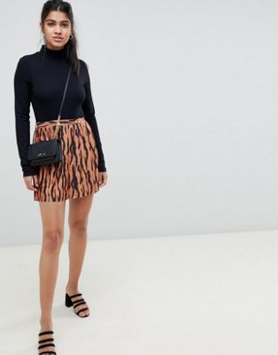 DESIGN pleated mini skirt in tiger print with gold buttons